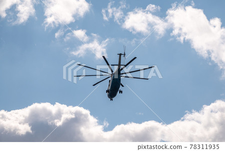 Moscow, Russia - May, 05, 2021: The Mi-26 helicopter flies over Red Square during the General rehearsal of the parade celebrating Victory Day in Moscow. Moscow, Russia - May, 05, 2021: The Mi-26 helicopter flies over Red Square during the General rehearsal of the parade celebrating Victory Day in Moscow. 78311935