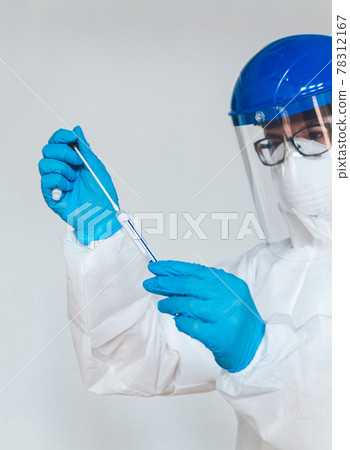 Female doctor or nurse in protective suit takes a specimen swab Female doctor or nurse in protective suit takes a specimen swab 78312167