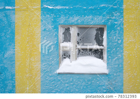 Window covered with snow after a snowstorm. 78312393