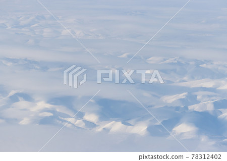 Aerial view of snow-capped mountains 78312402