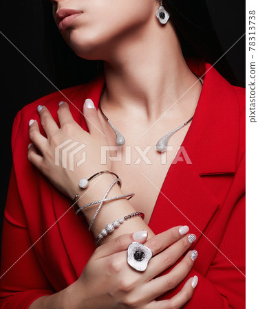 Young Woman with lots of jewelry Young Woman with lots of jewelry 78313738