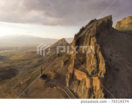 Fantastic Dramatic Aerial view of the ruins of the Dogubayazit castle, built on the mountain near Eski Bayezid Cami and the Ishak Pasha Palace. Eastern Turkey 78319374