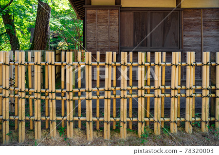 Walls and bamboo fences of old folk houses made of cypress skin Walls and bamboo fences of old folk houses made of cypress skin 78320003