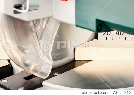 Miter saw cutting wood Miter saw cutting wood 78321740