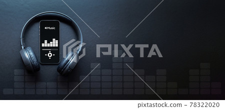 Music banner. Mobile smartphone screen with music application, sound headphones. Audio voice with radio beats on black background. Broadcast media music banner with copy space. 78322020