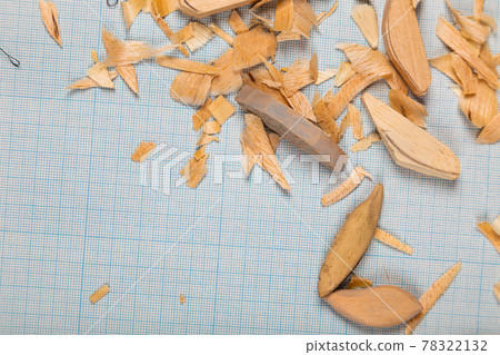 Handmade wooden fishing tacles graph paper background with tools and blanks. Handmade wooden fishing tacles graph paper background with tools and blanks. 78322132