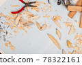 Handmade wooden fishing tacles graph paper background with tools and blanks. 78322161