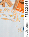 Handmade wooden fishing tacles graph paper background with tools and blanks. 78322163
