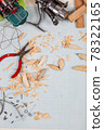 Handmade wooden fishing tacles graph paper background with tools and blanks. 78322165