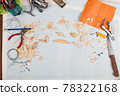 Handmade wooden fishing tacles graph paper background with tools and blanks. 78322168