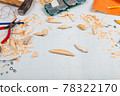 Handmade wooden fishing tacles graph paper background with tools and blanks. 78322170