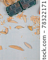 Handmade wooden fishing tacles graph paper background with tools and blanks. 78322171