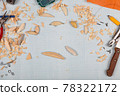 Handmade wooden fishing tacles graph paper background with tools and blanks. 78322172