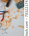 Handmade wooden fishing tacles graph paper background with tools and blanks. 78322174