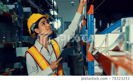 Female warehouse worker working at the storehouse Female warehouse worker working at the storehouse 78323251