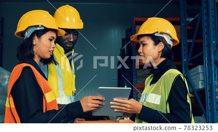 Warehouse worker working together in the storehouse Warehouse worker working together in the storehouse 78323253
