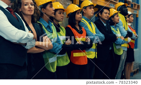 Large group of factory worker standing together in warehouse or storehouse Large group of factory worker standing together in warehouse or storehouse 78323340