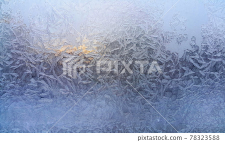Beautiful ice patterns on winter window Beautiful ice patterns on winter window 78323588