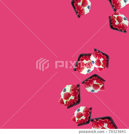 cakes fall from top to bottom on the right on the pink-fucshia background. Space for text and advertising. Summer sweet flat flay with copy space cakes fall from top to bottom on the right on the pink-fucshia background. Space for text and advertising. Summer sweet flat flay with copy space 78323641