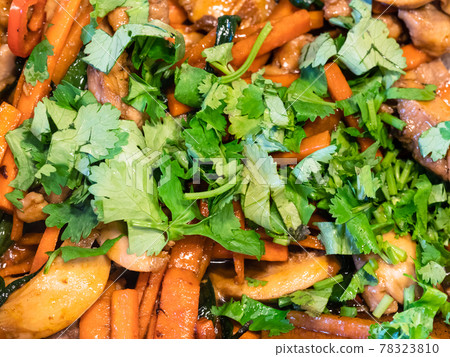fresh chopped cilantro on fried vegetables 78323810