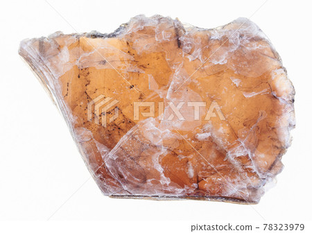 rough laminas of brown mica on white 78323979