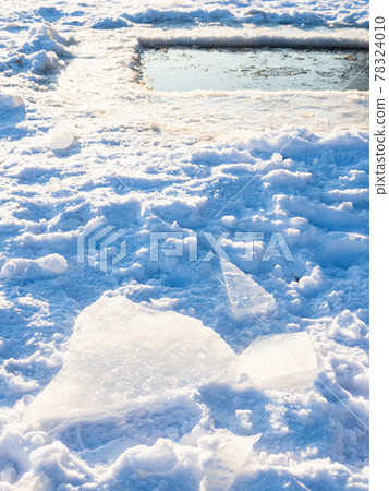 ice blocks on shore of ice-hole in frozen river ice blocks on shore of ice-hole in frozen river 78324010
