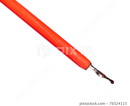 red ink drop on sharp nib of dip pen red ink drop on sharp nib of dip pen 78324113