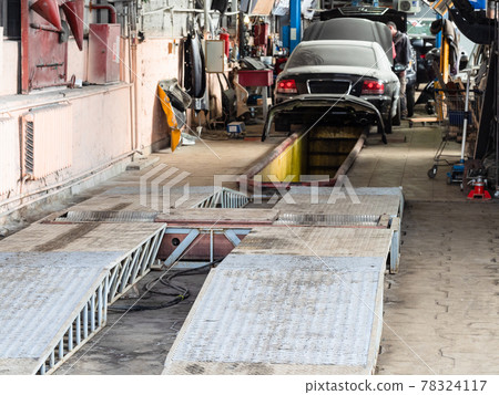 roller brake tester stand in old car workshop roller brake tester stand in old car workshop 78324117