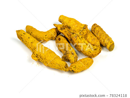 several dried roots of Turmeric closeup on white several dried roots of Turmeric closeup on white 78324118