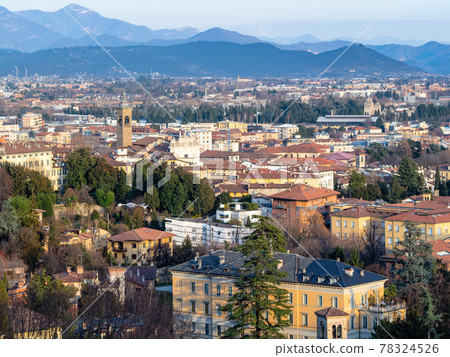 Alps mountain and Lower Town of Bergamo at sunset Alps mountain and Lower Town of Bergamo at sunset 78324526
