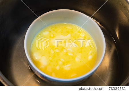 melted butter in bowl in water bath melted butter in bowl in water bath 78324581
