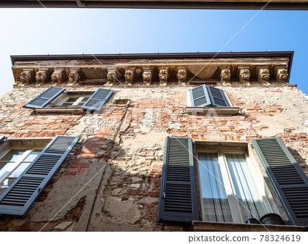 shabby medieval brick house on old narrow street 78324619