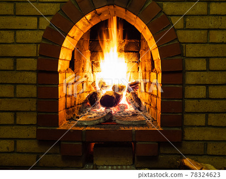 front view of burning firewood in fireplace front view of burning firewood in fireplace 78324623