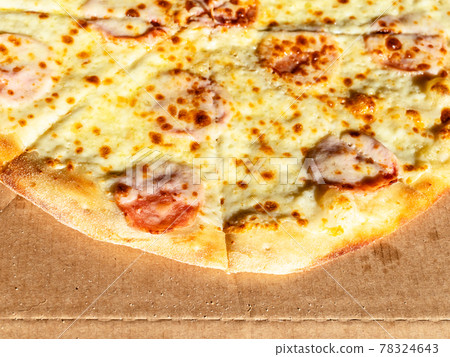 italian pizza with ham on cardboard box italian pizza with ham on cardboard box 78324643