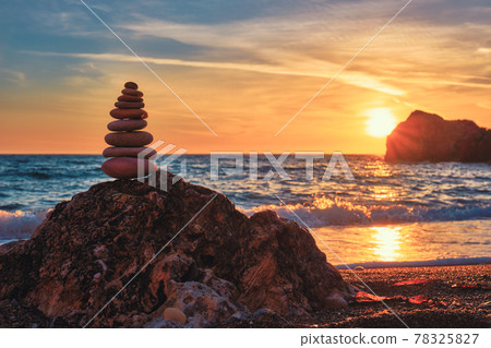 Concept of balance and harmony - stone stack on the beach 78325827
