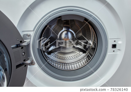 Washing machine with open door and empty drum. 78326140