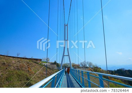 Mishima Skywalk and aerial walk: Large suspension bridge and blue sky 78326464