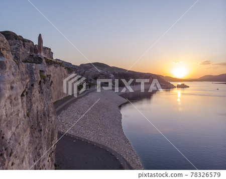 Aerial Drone Shot at sunset Time on the Tigres River in Eastern Turkey, Mesopotamia, the ancient city of Hasankeyf, caves in the rock 78326579