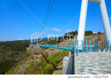 Mishima Skywalk and aerial walk: Large suspension bridge and blue sky Mishima Skywalk and aerial walk: Large suspension bridge and blue sky 78327595
