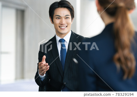 Business person talking face-to-face Business person talking face-to-face 78329194