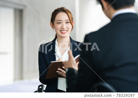 Career woman listening to the story at a meeting Career woman listening to the story at a meeting 78329197