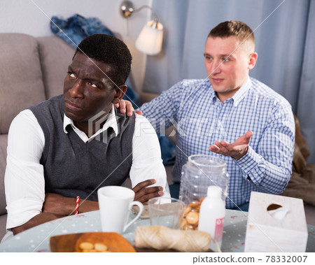 Unhappy male after conflict, friend tries reconcile Unhappy male after conflict, friend tries reconcile 78332007