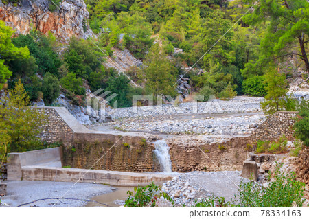 Small waterfall on mountain river in Kesme Bogaz canyon, Antalya province in Turkey Small waterfall on mountain river in Kesme Bogaz canyon, Antalya province in Turkey 78334163