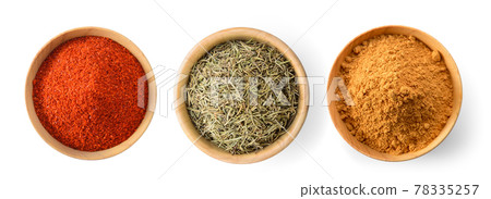 Cayenne pepper in wood bowl on white background Cayenne pepper in wood bowl on white background 78335257