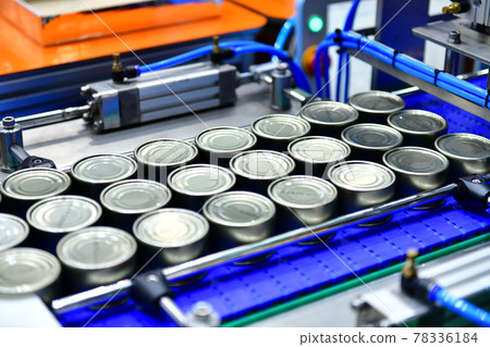 Canned food products on conveyor belt in distribution warehouse. parcels transportation system concept. 78336184
