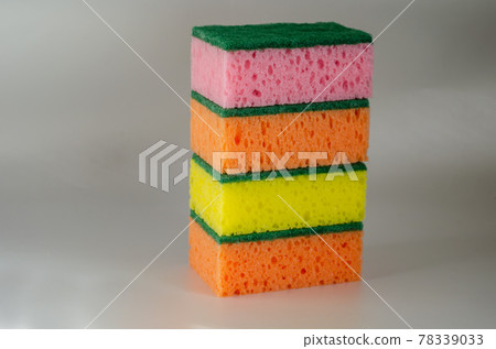 New multi-colored kitchen sponges on a light background. New multi-colored kitchen sponges on a light background. 78339033