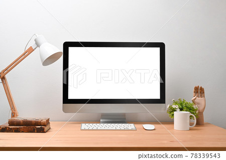 Modern Scandinavian home interior with mock up computer, lamp, coffee cup, books and plant on wooden desk. Modern Scandinavian home interior with mock up computer, lamp, coffee cup, books and plant on wooden desk. 78339543