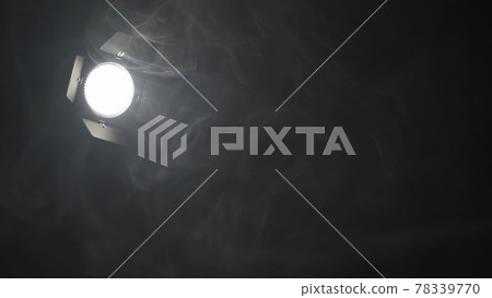 Photo of spotlight in smoke on black background 78339770