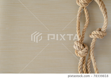 Hemp rope with knots. 78339818