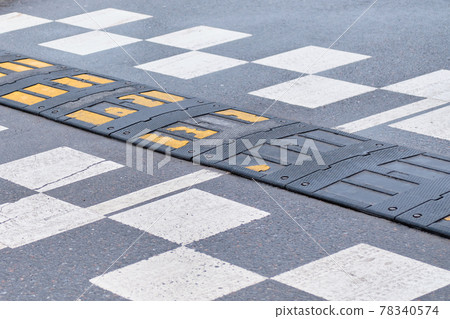 Speed bump on the pavement. Speed bump on the pavement. 78340574